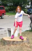 girl on stump