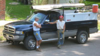 2 men, pickup truck