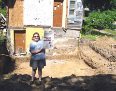 woman holding newspaper near pit