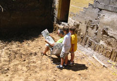 man, boys, newspaper in pit